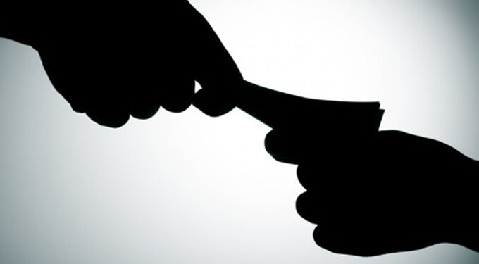 Police officers up for demanding US$40  bribe