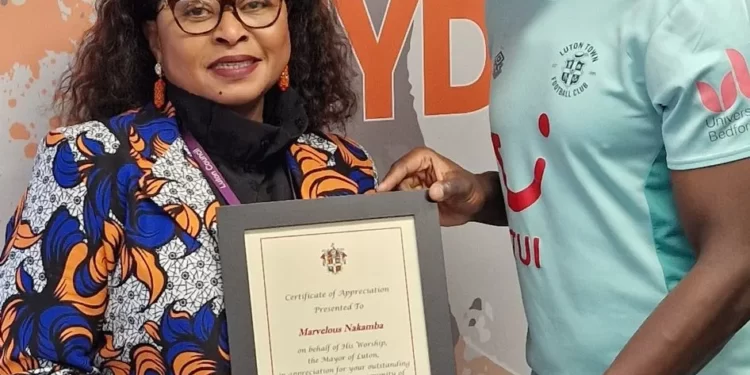 Marvelous Nakamba presented an award by the Luton
